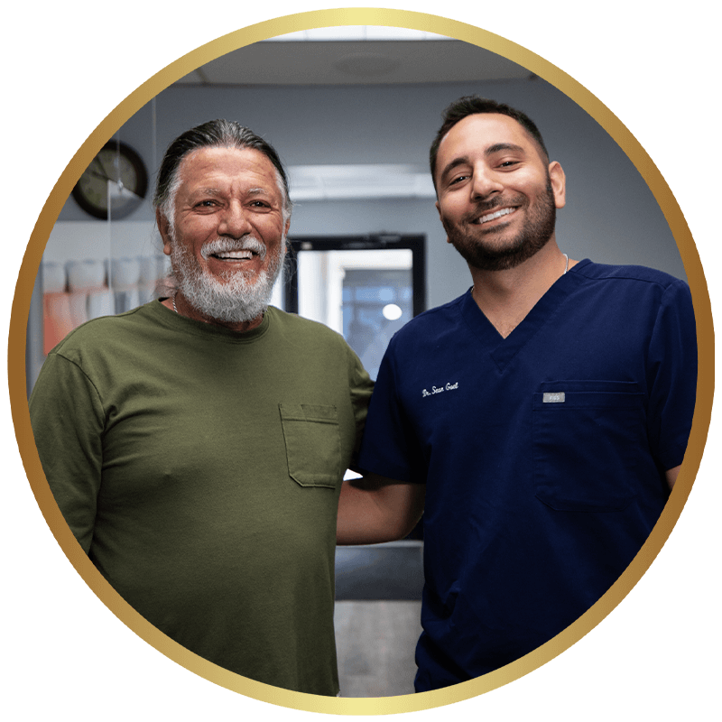 An ADHP implant dentist reviewing a treatment plan with a patient