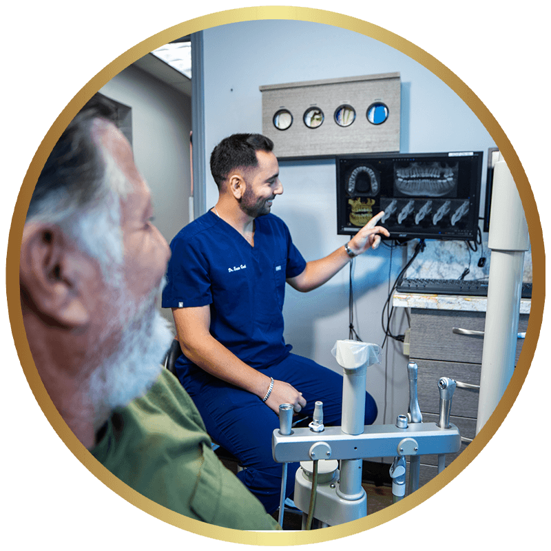 An implant dentist reviewing a digital scan of a full arch