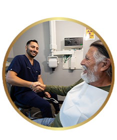 An ADHP implant dentist reviewing treatment with a patient